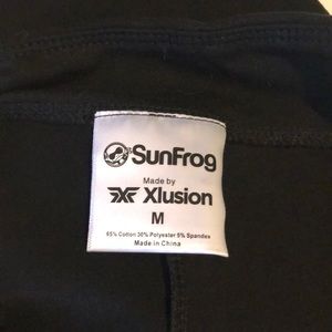 Two pairs of SunFrog black leggings for $15